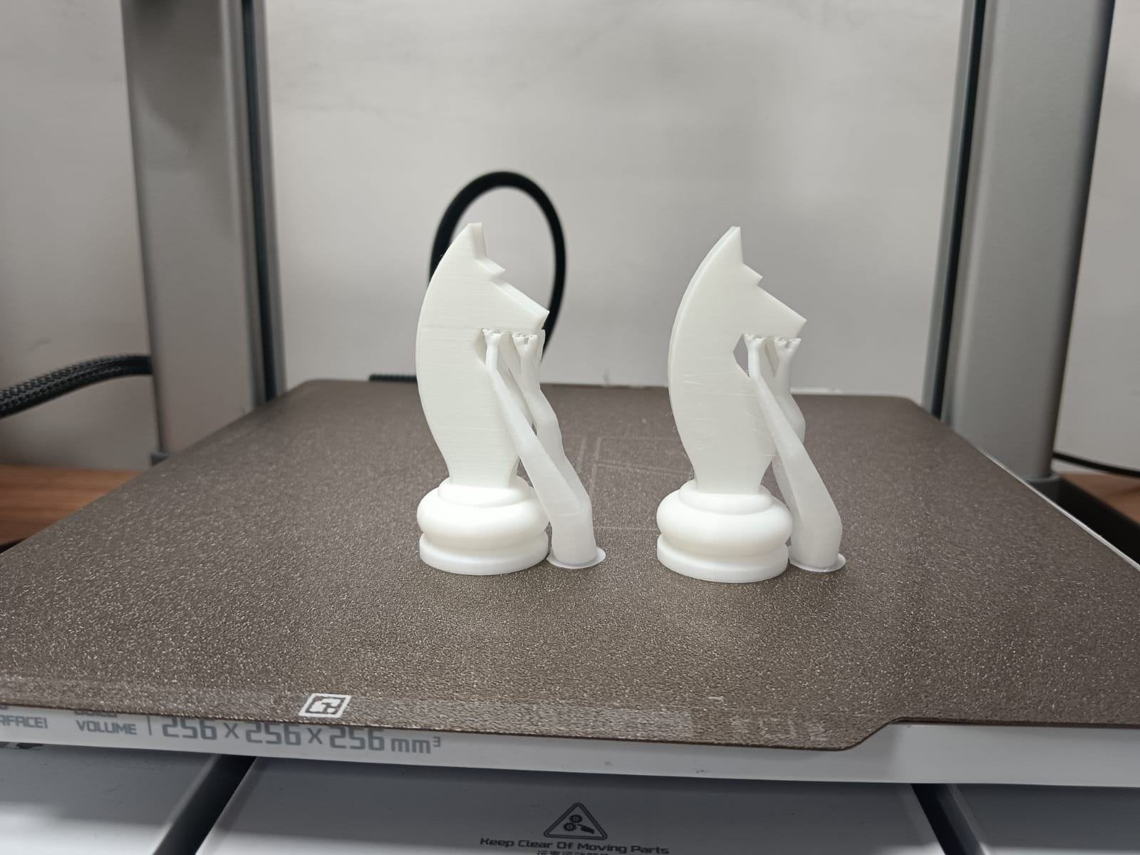 Two finished knights on the printer bed