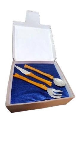 The cutlery set laid in an open presentation box